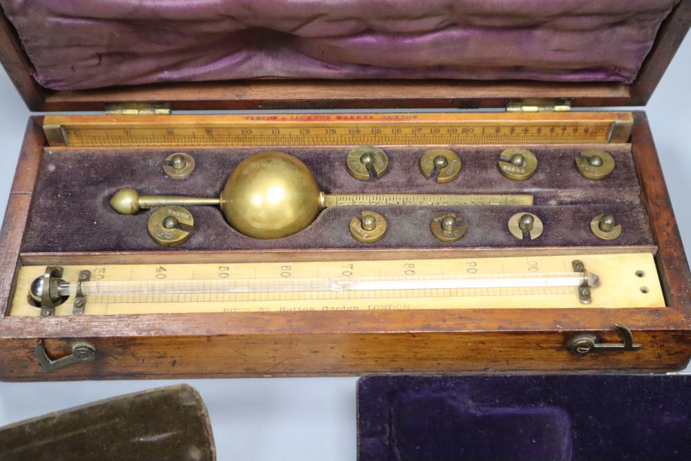 A 19th century brass Polar Planimeter (Amsler short-arm type) by Stanley, with weight and two other items,